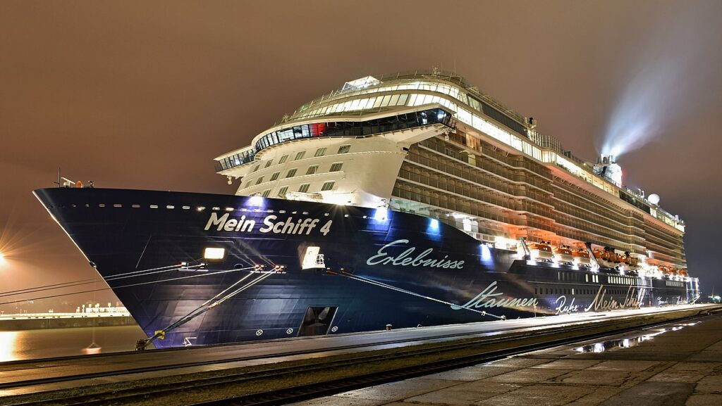 Mein Schiff 4 of TUI Cruises in Rostock Port (Pier II, berth 41), night view from southeast.